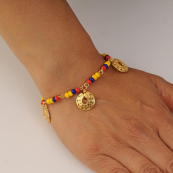 PULSERA COLOMBIA CON 3 DIJES MINI NARIGUERA DE CIRCULOS QUIMBAYA - Blumart